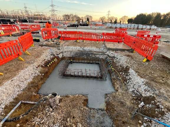 Square pad foundation with starter bars on blinding concrete